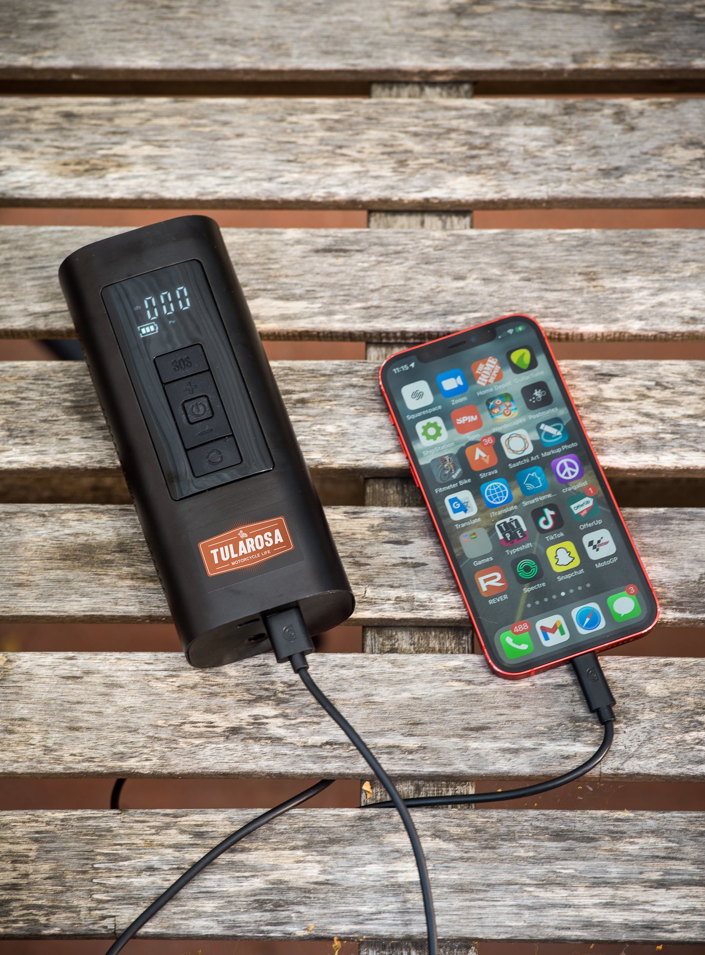 Air Compressor charging mobile phone.
